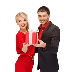 Image showing smiling woman and man with gift box