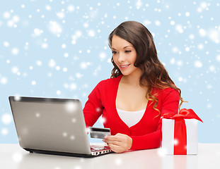 Image showing woman with gift, laptop computer and credit card