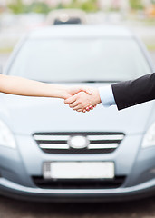 Image showing customer and salesman shaking hands