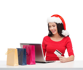 Image showing woman with gifts, laptop computer and credit card