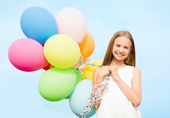 Image showing happy girl with colorful balloons