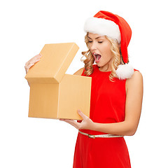 Image showing smiling woman in santa helper hat with gift box