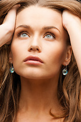 Image showing eautiful calm woman with beautiful earrings