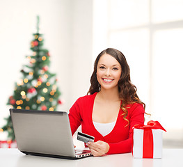 Image showing woman with gift, laptop computer and credit card