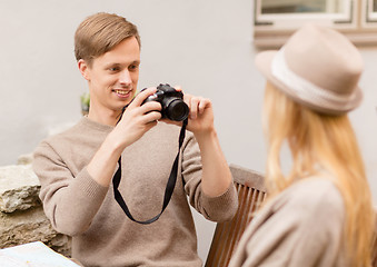 Image showing couple taking photo picture in cafe