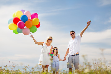 Image showing family with colorful balloons