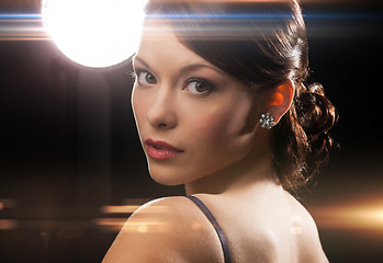 Image showing woman in evening dress wearing diamond earrings