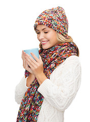 Image showing woman in hat with red tea or coffee mug