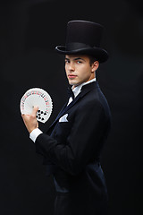 Image showing magician showing trick with playing cards