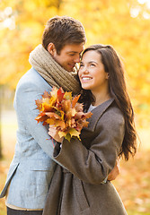 Image showing romantic couple kissing in the autumn park