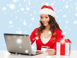 Image showing woman with gift, laptop computer and credit card