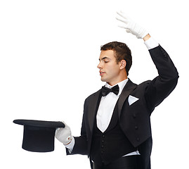 Image showing magician in top hat showing trick