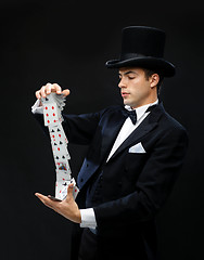 Image showing magician showing trick with playing cards