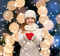 Image showing girl in winter clothes with small red heart