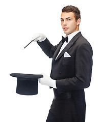 Image showing magician in top hat with magic wand showing trick