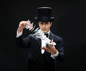 Image showing magician showing trick with playing cards