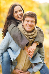 Image showing romantic couple playing in the autumn park