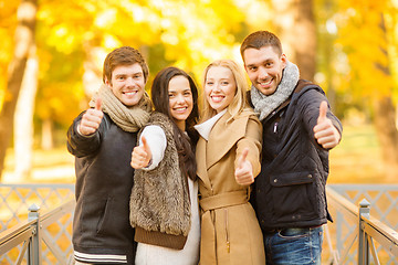 Image showing group of friends having fun in autumn park