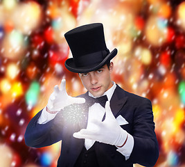 Image showing magician in top hat showing trick