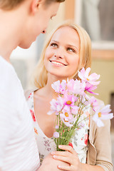 Image showing couple with flowers in the city