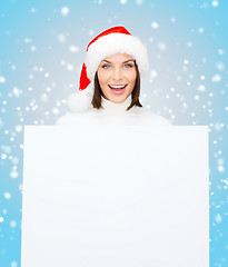 Image showing woman in santa helper hat with blank white board