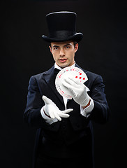 Image showing magician showing trick with playing cards