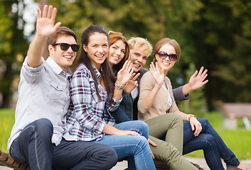 Image showing group of students or teenagers waving hands