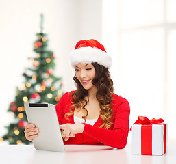 Image showing woman with gift box and tablet pc computer