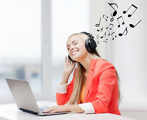 Image showing happy woman with headphones listening to music