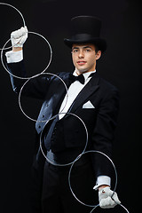 Image showing magician showing trick with linking rings