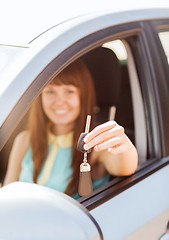 Image showing happy woman holding car key