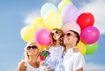 Image showing family with colorful balloons