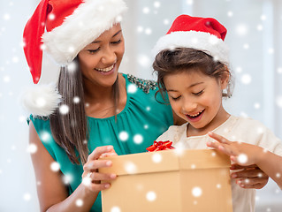 Image showing happy mother and child girl with gift box