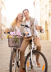 Image showing couple with bicycles in the city