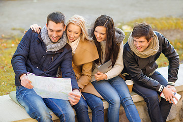 Image showing couples with tourist map in autumn park