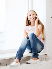 Image showing girl with smartphone at school