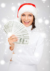 Image showing woman in santa helper hat with us dollar money