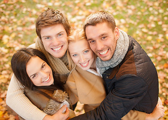 Image showing group of friends having fun in autumn park