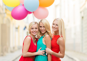 Image showing beautiful girls with colorful balloons in the city