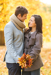 Image showing romantic couple kissing in the autumn park