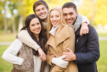 Image showing group of friends having fun in autumn park