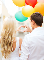 Image showing couple with colorful balloons