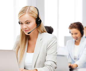 Image showing friendly female helpline operator