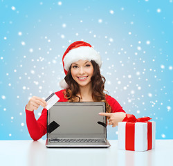 Image showing woman with gift, laptop computer and credit card