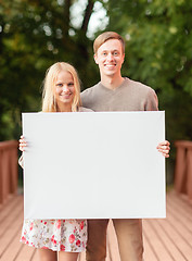 Image showing romantic couple with blank white board