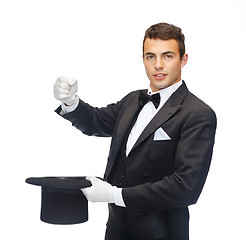 Image showing magician in top hat showing trick