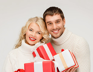 Image showing smiling woman and man with gift box