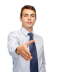 Image showing friendly buisnessman with hand ready for handshake