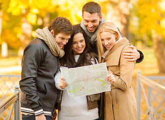 Image showing couples with tourist map in autumn park