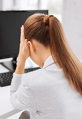 Image showing stressed woman with computer